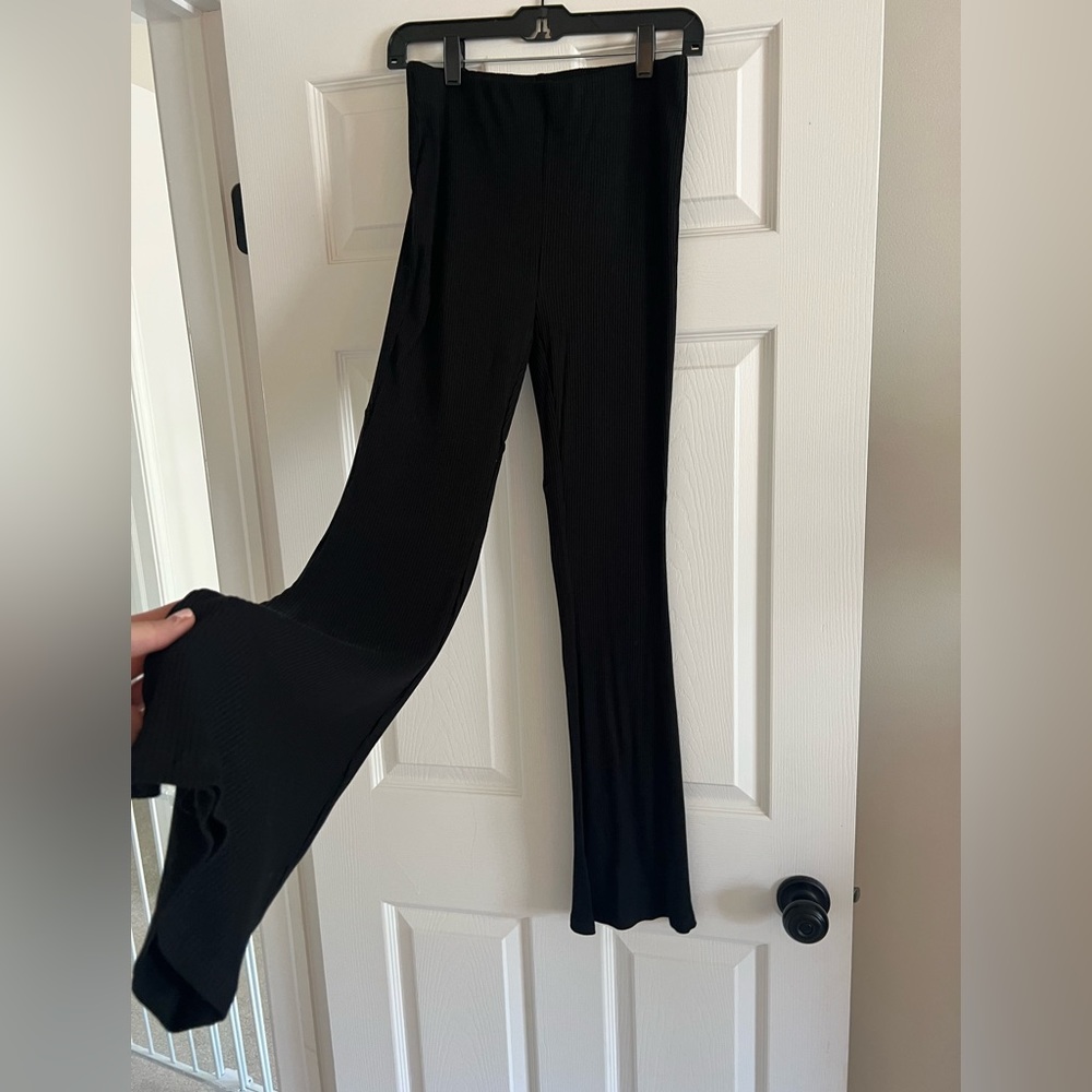 H&M black ribbed flare pants- size small. Never worn